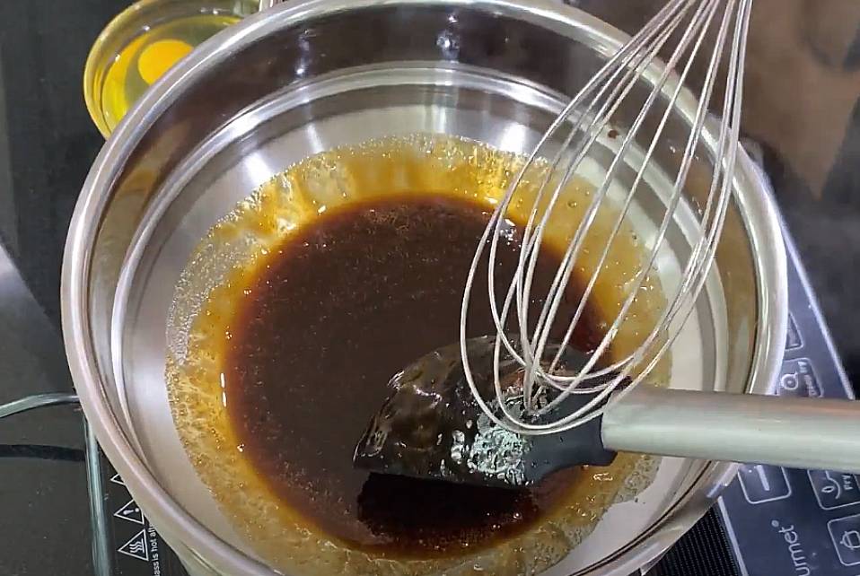 scrape kaya on the spatula with a whisk