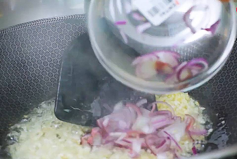 add in the minced garlic and shallots into the honeycomb wok