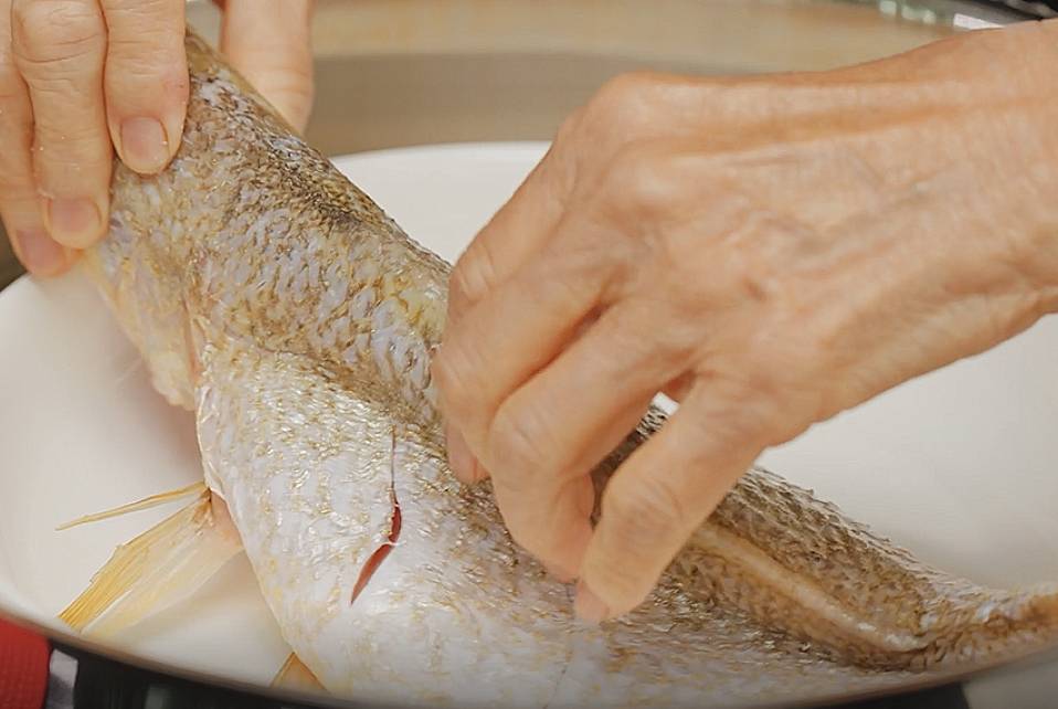 place the fish butterfly style into the steamer